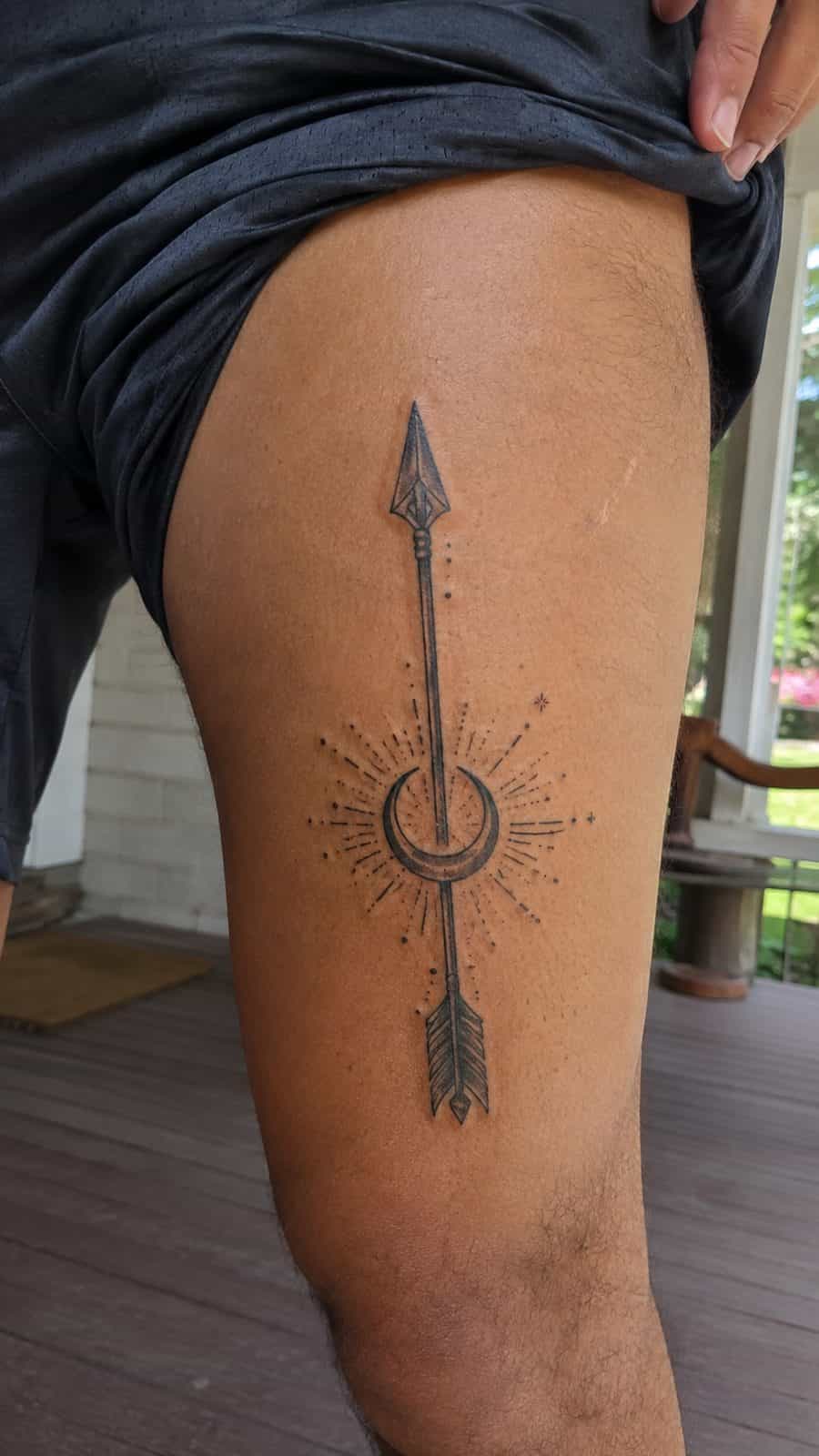 Modern Spartan: 18 Greek Tattoo Ideas Every Man Should Consider 32 Healed artemis's arrow tattoo on a adult man's outer thigh, photographed in a natural straight-on close view, a touch off-center like — study 2