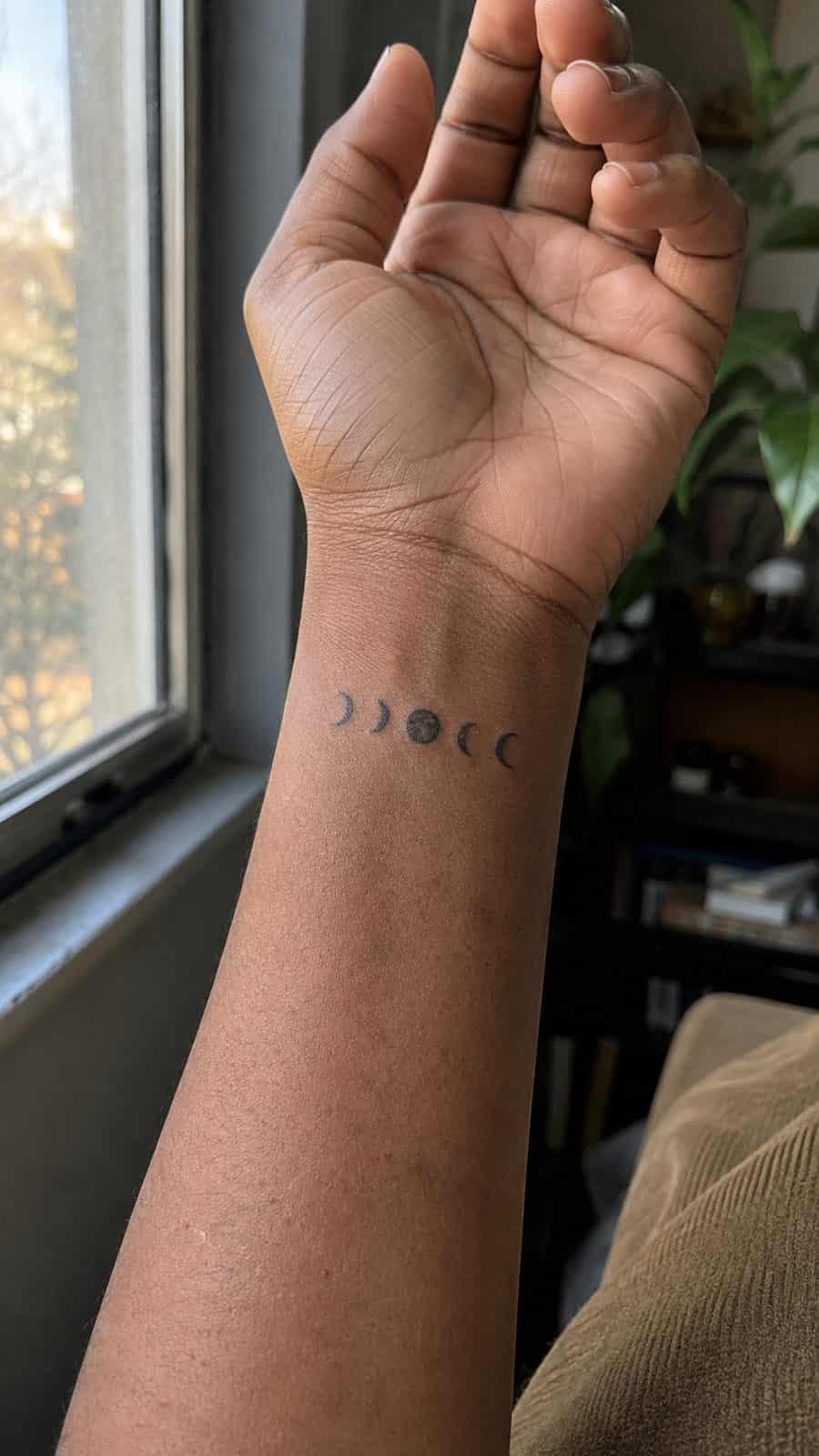 Wrist Tattoos Women Are Raving About: Discover the 28 Most Gorgeous Designs 5 Healed minimalist moon phases tattoo on a adult woman's inner wrist, photographed in a natural relaxed documentary crop — study 2