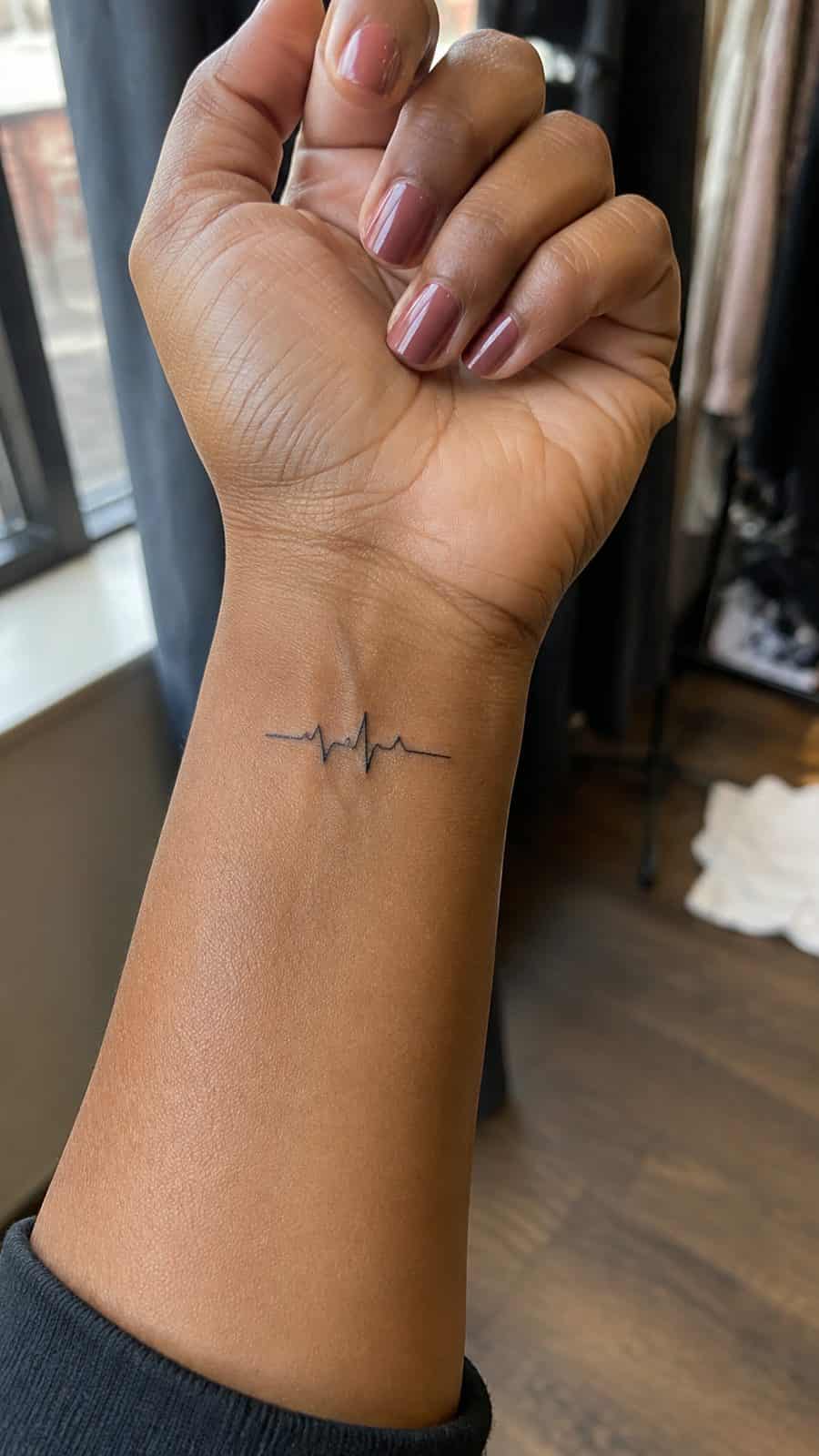 Wrist Tattoos Women Are Raving About: Discover the 28 Most Gorgeous Designs 11 Healed tiny heartbeat line tattoo on a adult woman's inner wrist, photographed in a natural straight-on close view, a touch — study 1