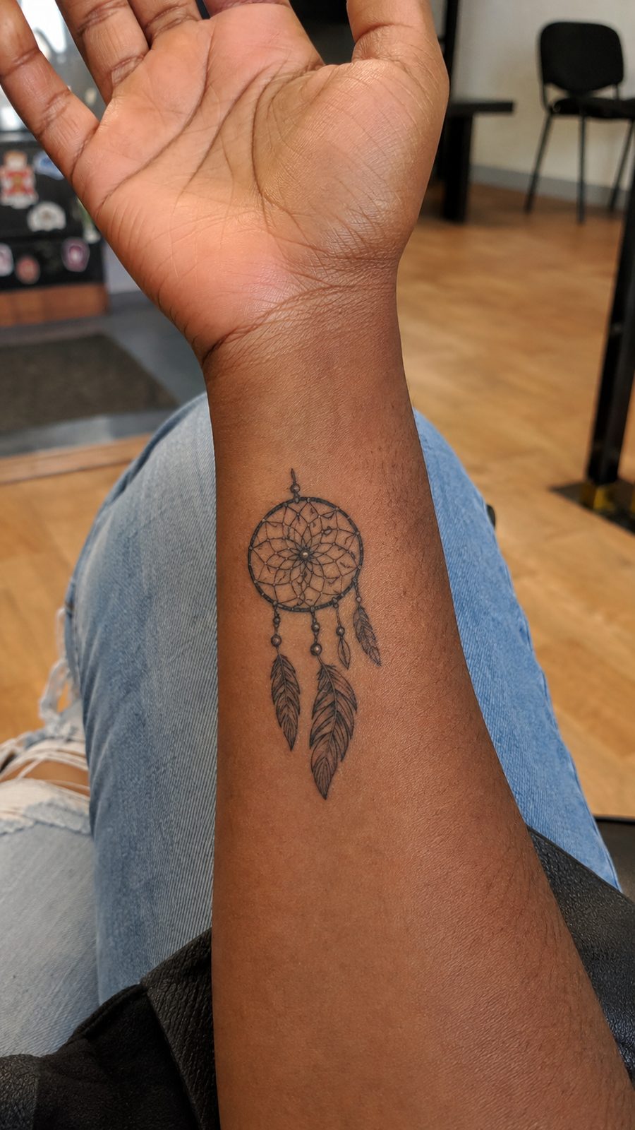 Wrist Tattoos Women Are Raving About: Discover the 28 Most Gorgeous Designs 13 Healed dreamcatcher charm tattoo on a adult woman's inner wrist, photographed in a natural relaxed documentary crop — study 1
