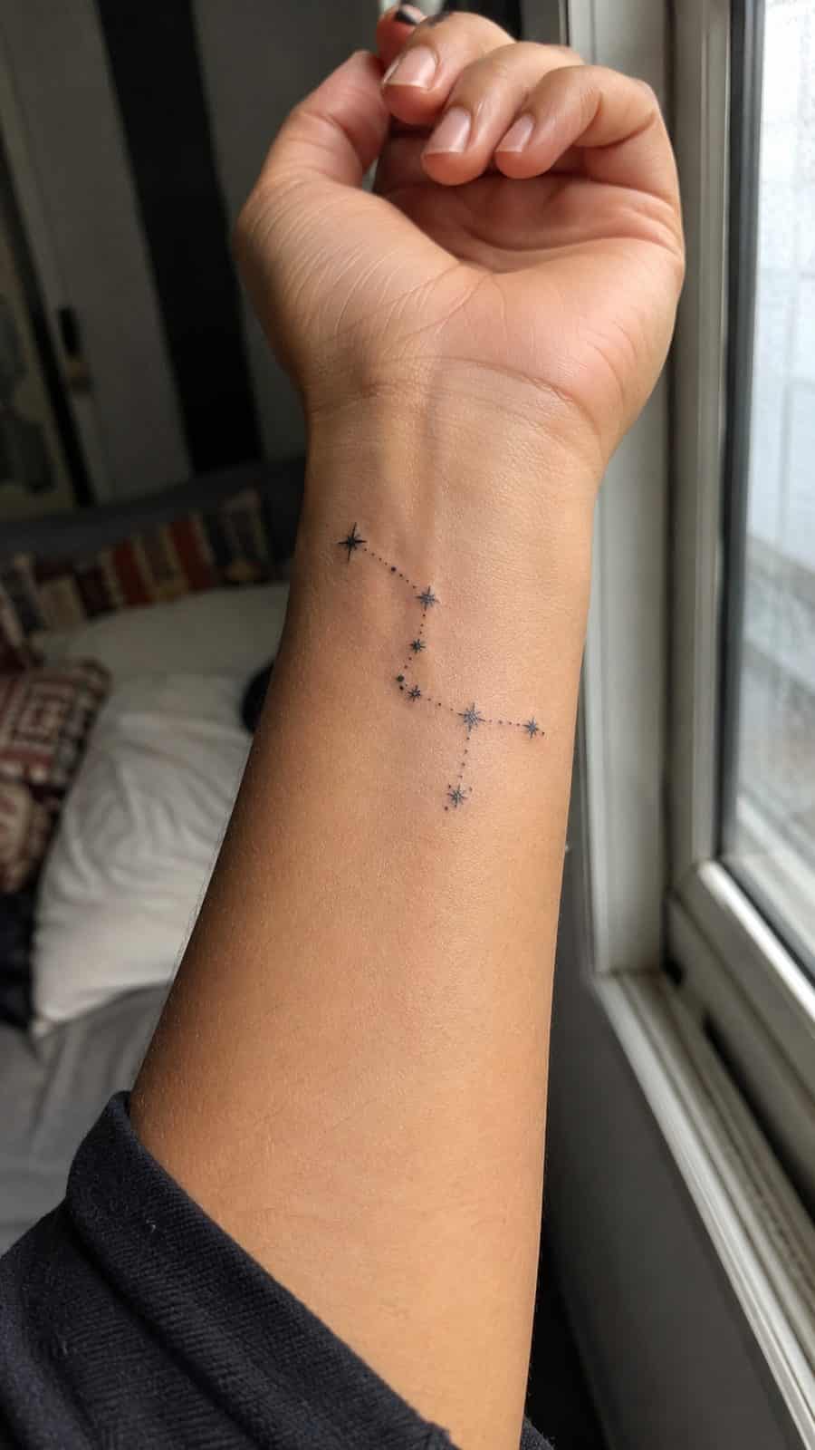 Wrist Tattoos Women Are Raving About: Discover the 28 Most Gorgeous Designs 17 Healed constellation of stars tattoo on a adult woman's inner wrist, photographed in a natural casual close three-quarter view — study 1