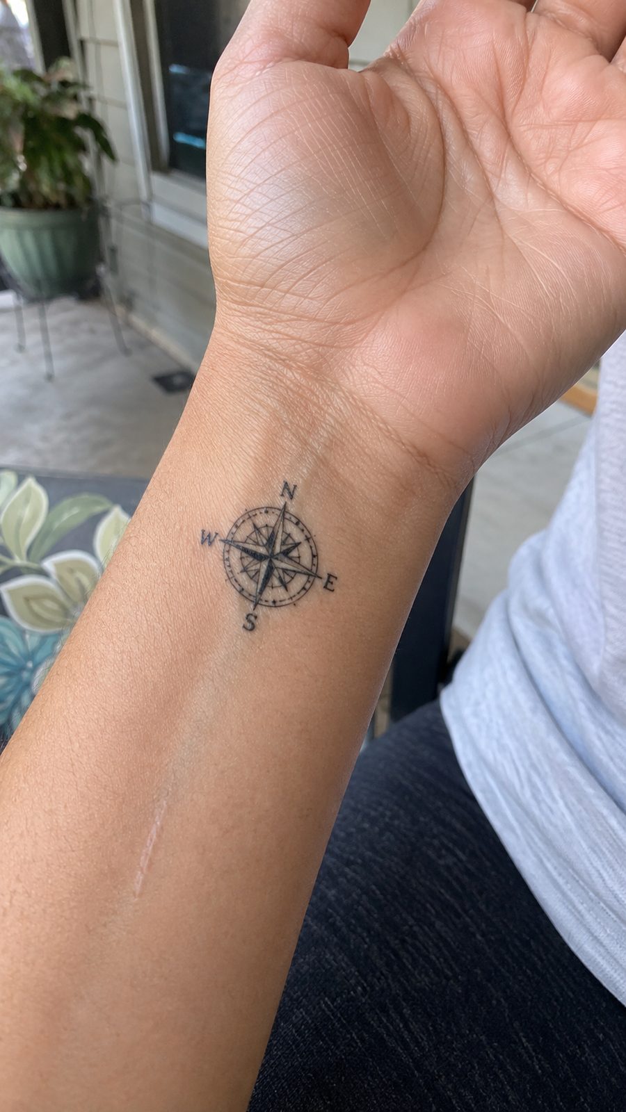 Wrist Tattoos Women Are Raving About: Discover the 28 Most Gorgeous Designs 21 Healed small compass design tattoo on a adult woman's inner wrist, photographed in a natural straight-on close view, a touch — study 1