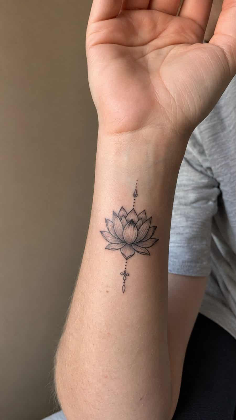 Wrist Tattoos Women Are Raving About: Discover the 28 Most Gorgeous Designs 30 Healed lotus blossom elegance tattoo on a adult woman's inner wrist, photographed in a natural straight-on close view, a touch — study 1