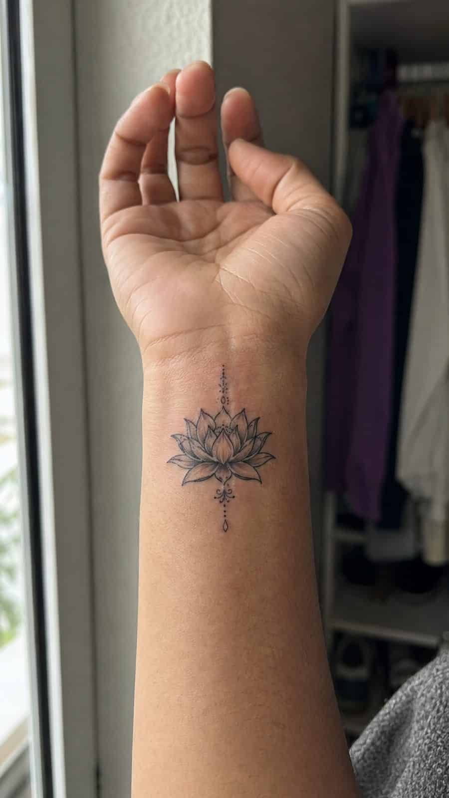 Wrist Tattoos Women Are Raving About: Discover the 28 Most Gorgeous Designs 31 Healed lotus blossom elegance tattoo on a adult woman's inner wrist, photographed in a natural gentle side angle that clearly shows — study 2