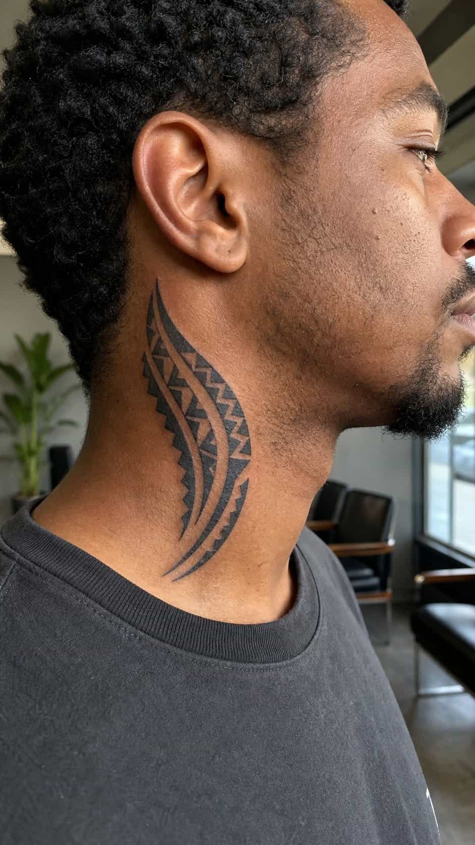 15 Neck Tattoo Ideas for Men Worth Considering 10 Healed tribal heritage tattoo on a adult man's side ribs, photographed in a natural gentle side angle that clearly shows how the ink — study 2
