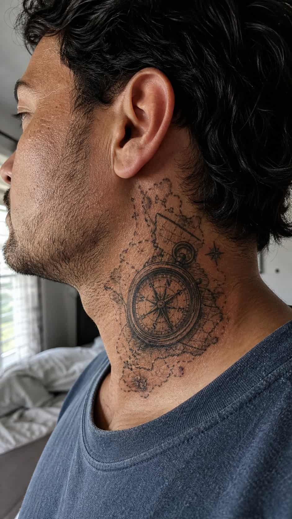 15 Neck Tattoo Ideas for Men Worth Considering 11 Healed vintage compass and map tattoo on a adult man's side neck, photographed in a natural waist-height candid close-up — study 1