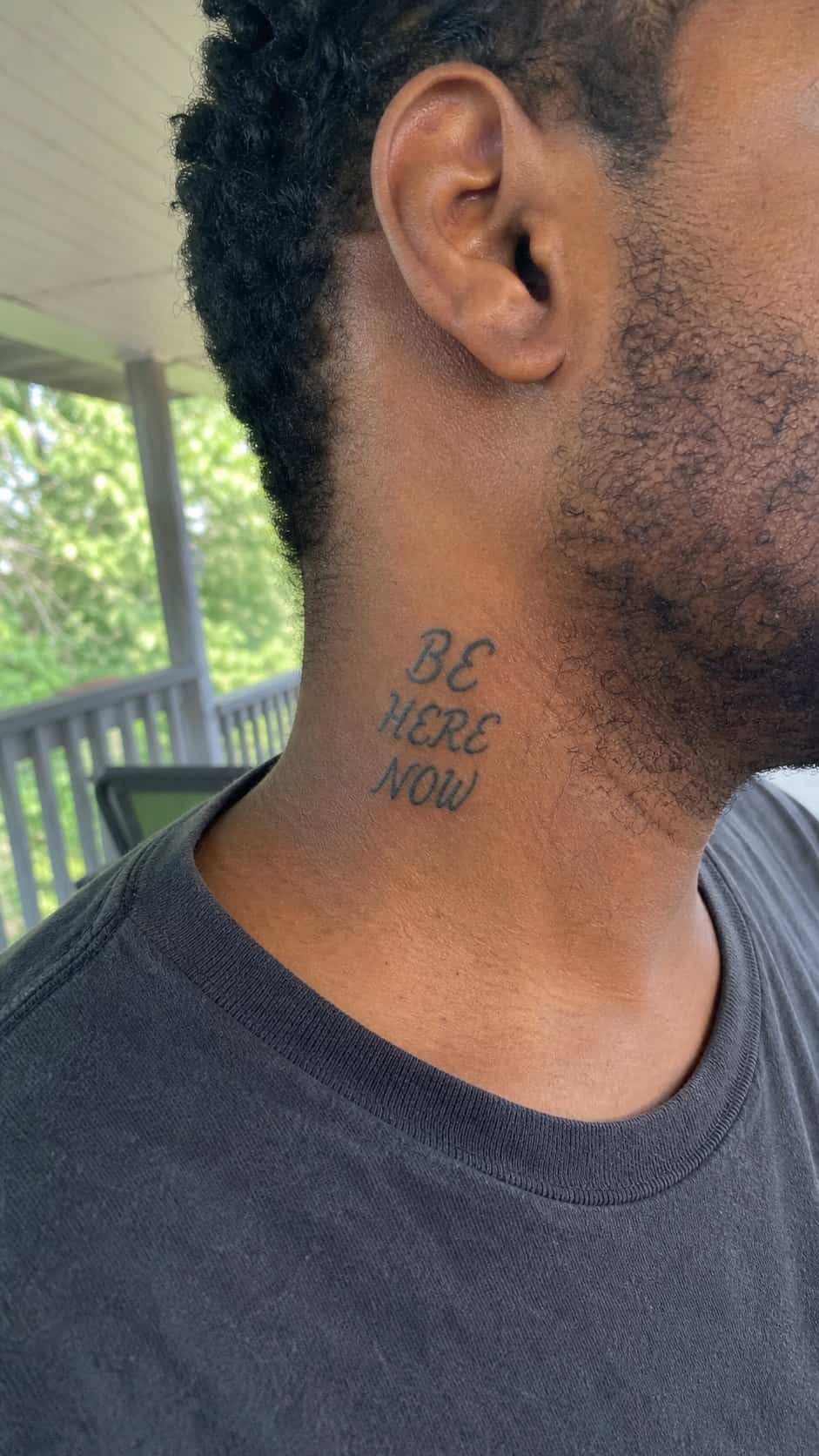 15 Neck Tattoo Ideas for Men Worth Considering 24 Healed cultural calligraphy tattoo on a adult man's side neck, photographed in a natural relaxed documentary crop — study 2