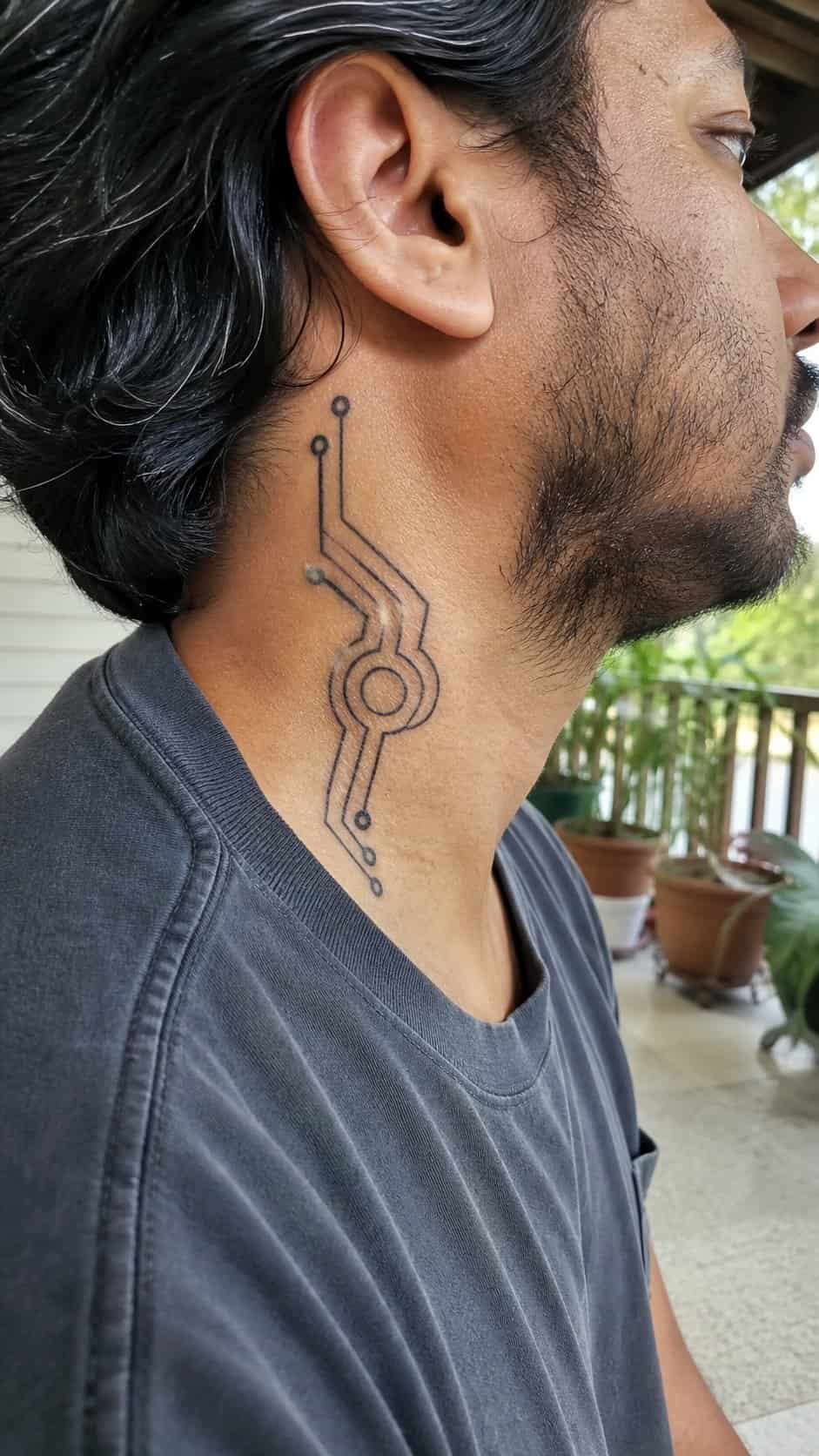 15 Neck Tattoo Ideas for Men Worth Considering 28 Healed futuristic tech design tattoo on a adult man's side neck, photographed in a natural gentle side angle that clearly shows how — study 2