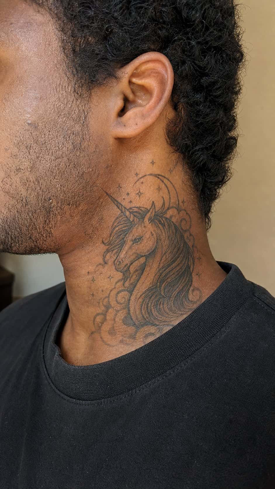 15 Neck Tattoo Ideas for Men Worth Considering 32 Healed fantasy elements tattoo on a adult man's side neck, photographed in a natural relaxed documentary crop — study 2