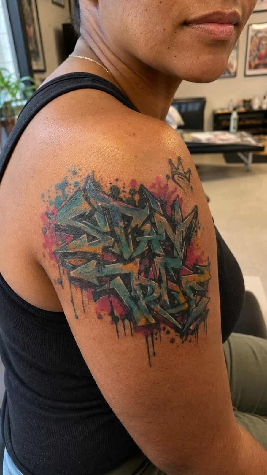 20 Edgy Grunge Tattoo Ideas for Women Who Break the Rules 14 Healed urban graffiti elements tattoo on a adult woman's shoulder, photographed in a natural casual close three-quarter view — study 1