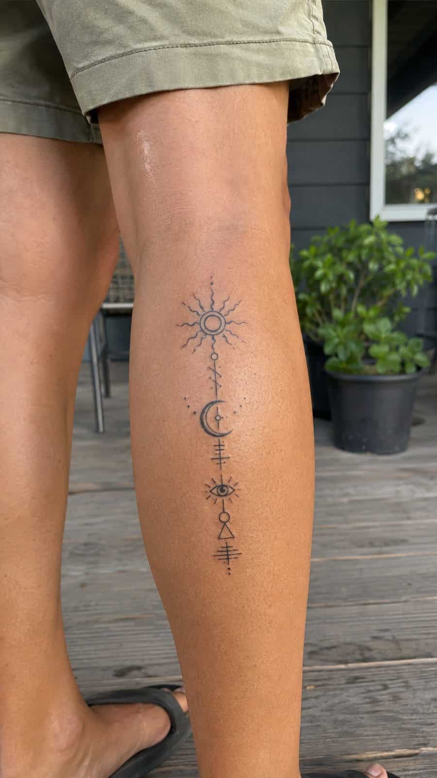 20 Edgy Grunge Tattoo Ideas for Women Who Break the Rules 33 Healed enigmatic symbols tattoo on a adult woman's outer calf, photographed in a natural waist-height candid close-up — study 2