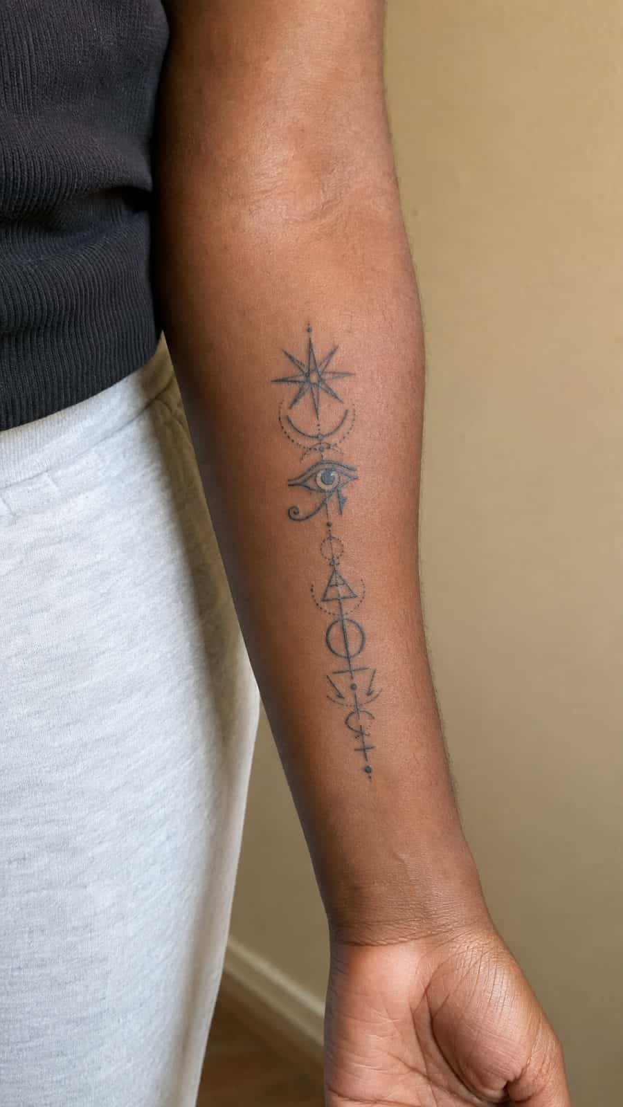 20 Edgy Grunge Tattoo Ideas for Women Who Break the Rules 34 Healed enigmatic symbols tattoo on a adult woman's inner forearm, photographed in a natural relaxed documentary crop — study 3