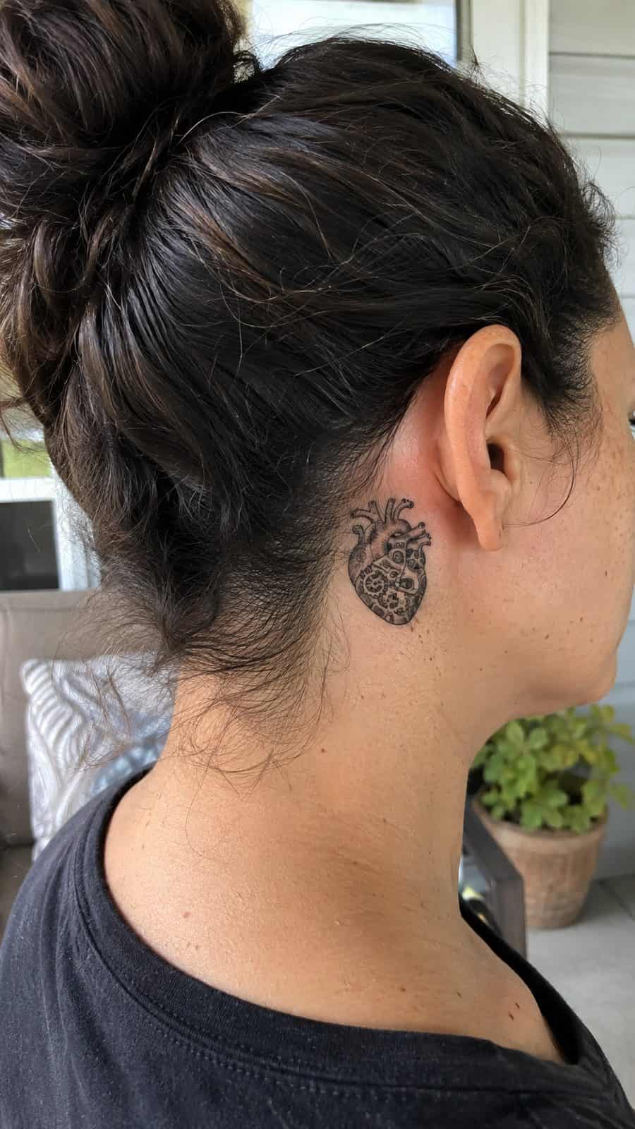 20 Edgy Grunge Tattoo Ideas for Women Who Break the Rules 36 Healed mechanical heart tattoo on a adult woman's behind the ear, photographed in a natural slightly elevated close view — study 2