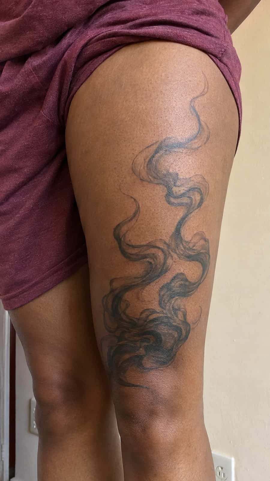20 Edgy Grunge Tattoo Ideas for Women Who Break the Rules 38 Healed ethereal smoke tattoo on a adult woman's outer thigh, photographed in a natural relaxed documentary crop — study 2