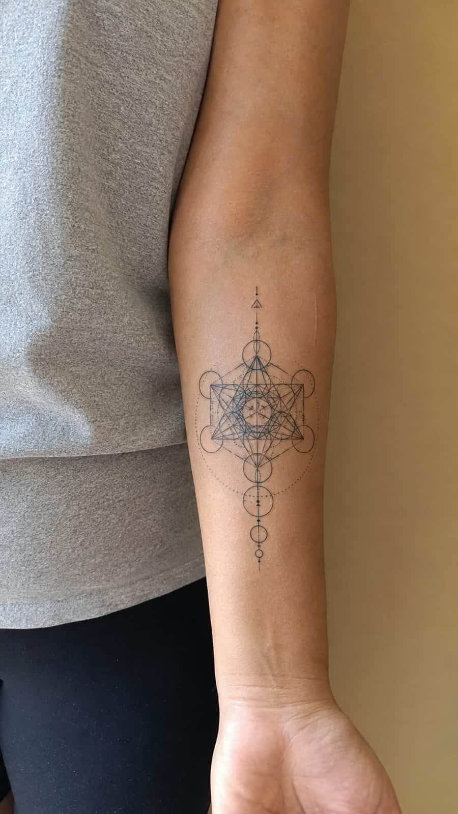20 Edgy Grunge Tattoo Ideas for Women Who Break the Rules 42 Healed sacred geometry tattoo on a adult woman's inner forearm, photographed in a natural straight-on close view, a touch off-center — study 3