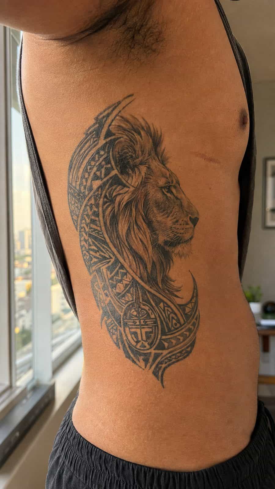 Unleash Your Inner Strength: 20 Male Lion Tattoo Ideas You Need to See 26 Healed tribal majesty tattoo on a adult man's side ribs, photographed in a natural straight-on close view, a touch off-center like a — study 2