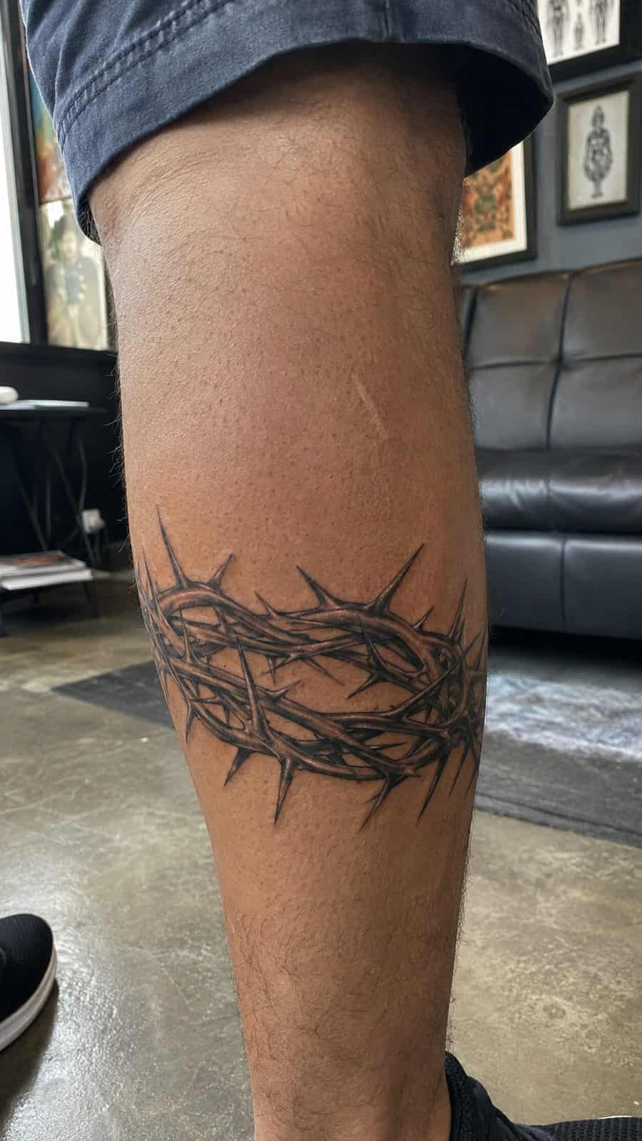 Unleash Your Inner Strength: 20 Male Lion Tattoo Ideas You Need to See 36 Healed crown of thorns tattoo on a adult man's outer calf, photographed in a natural casual close three-quarter view — study 3