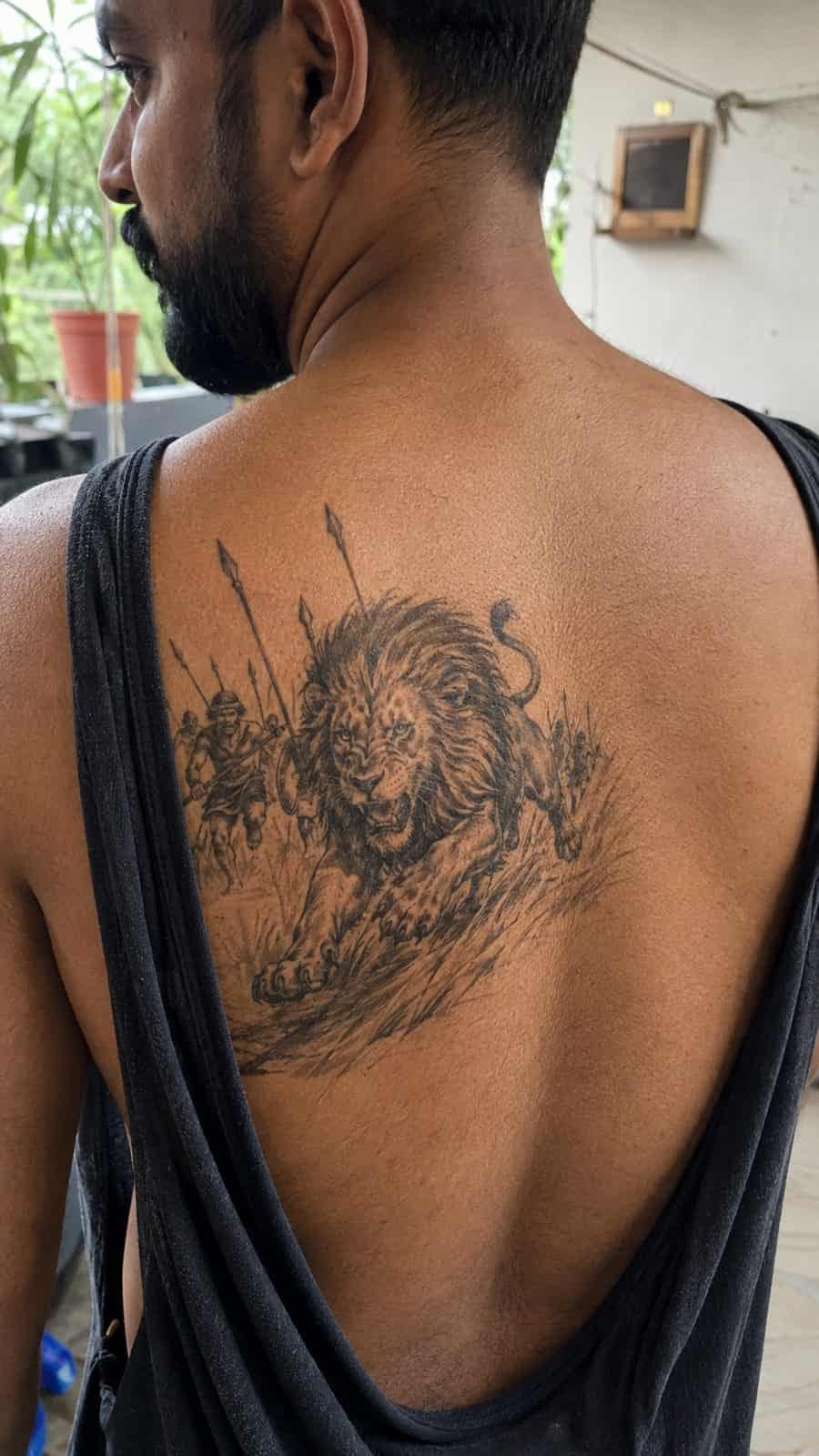Unleash Your Inner Strength: 20 Male Lion Tattoo Ideas You Need to See 37 Healed the hunt tattoo on a adult man's upper back, photographed in a natural gentle side angle that clearly shows how the ink wraps — study 1