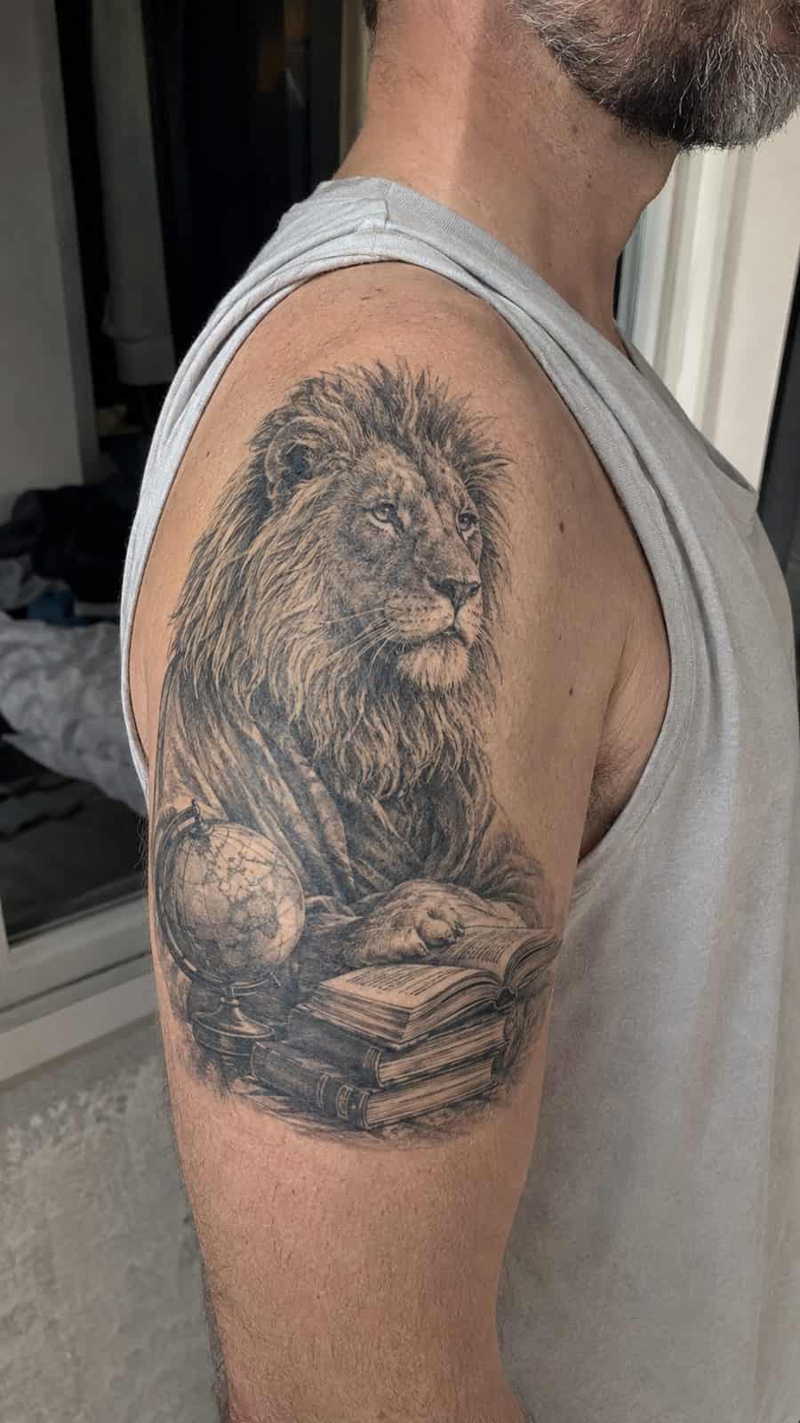 Unleash Your Inner Strength: 20 Male Lion Tattoo Ideas You Need to See 44 Healed wisdom of the ages tattoo on a adult man's shoulder, photographed in a natural waist-height candid close-up — study 1