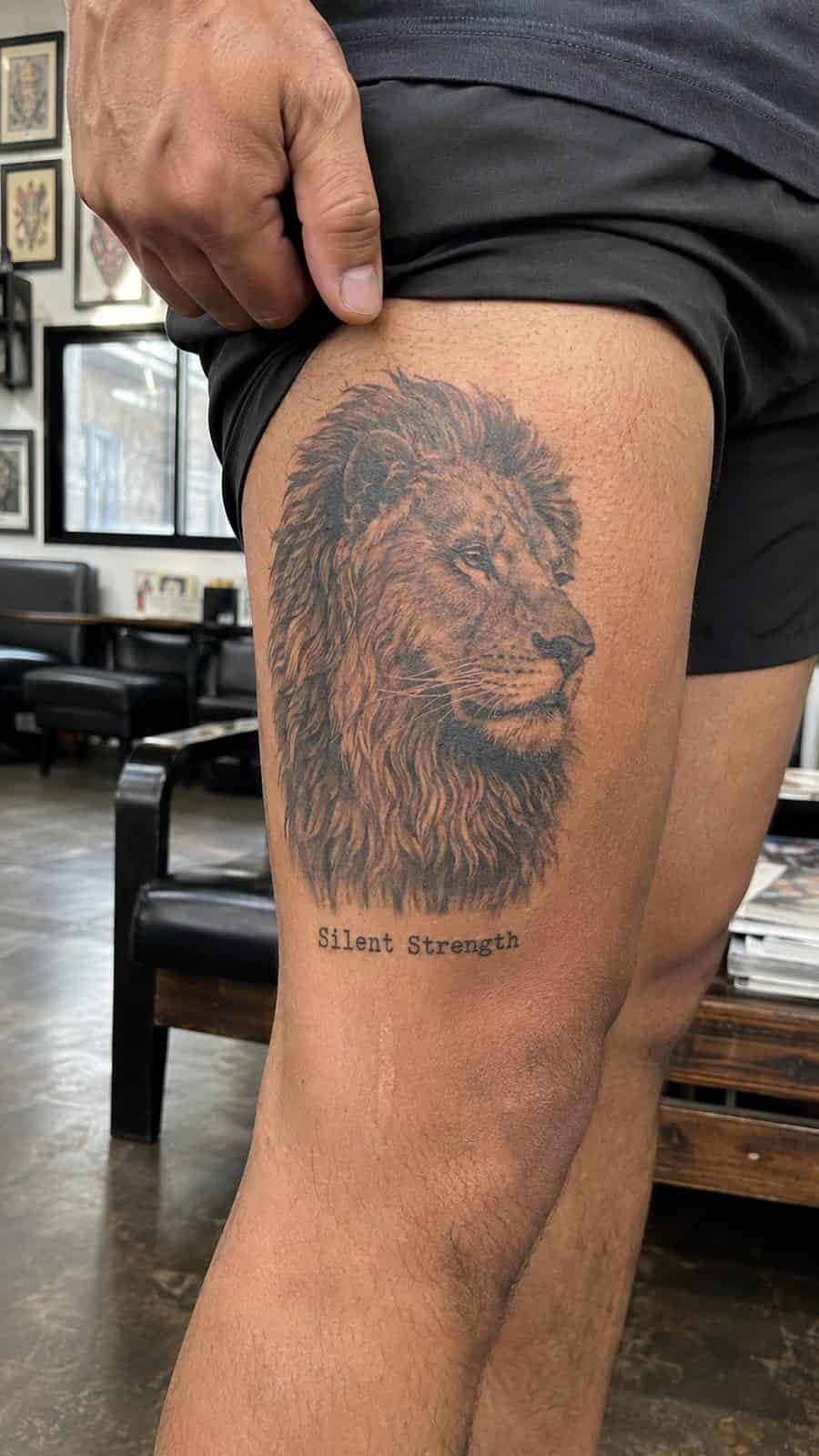 Unleash Your Inner Strength: 20 Male Lion Tattoo Ideas You Need to See 49 Healed silent strength tattoo on a adult man's outer thigh, photographed in a natural slightly elevated close view — study 2