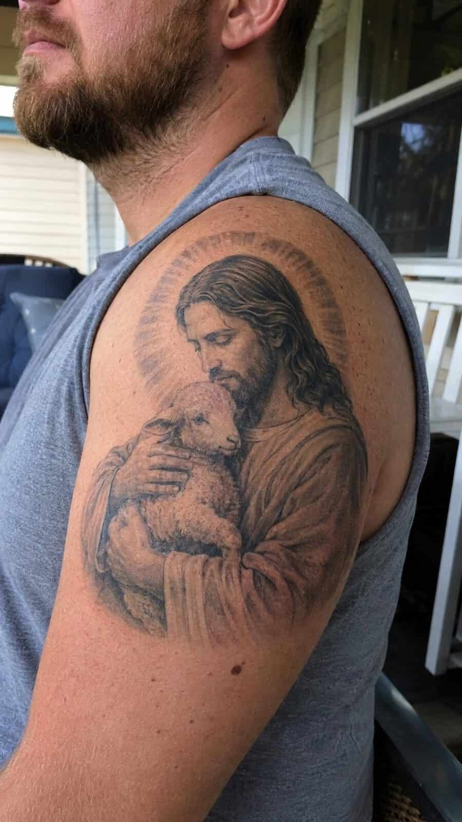 Exploring 18 Profound Jesus Tattoo Ideas for the Modern Man 9 Healed jesus with the lamb tattoo on a adult man's shoulder, photographed in a natural gentle side angle that clearly shows how the — study 1