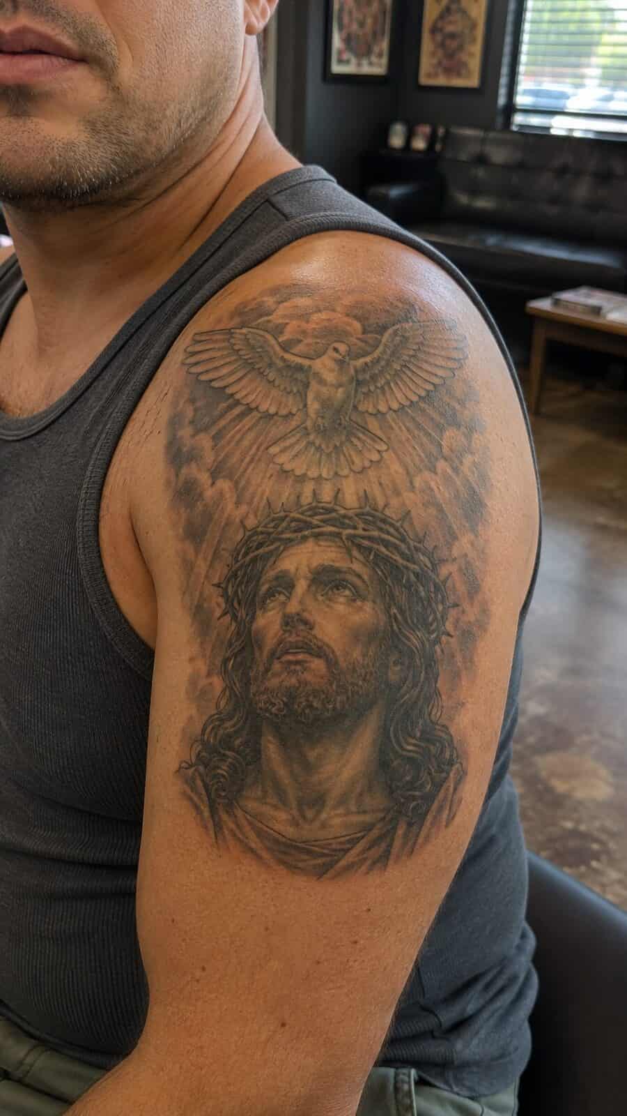 Exploring 18 Profound Jesus Tattoo Ideas for the Modern Man 20 Healed jesus and the dove tattoo on a adult man's shoulder, photographed in a natural straight-on close view, a touch off-center like — study 1