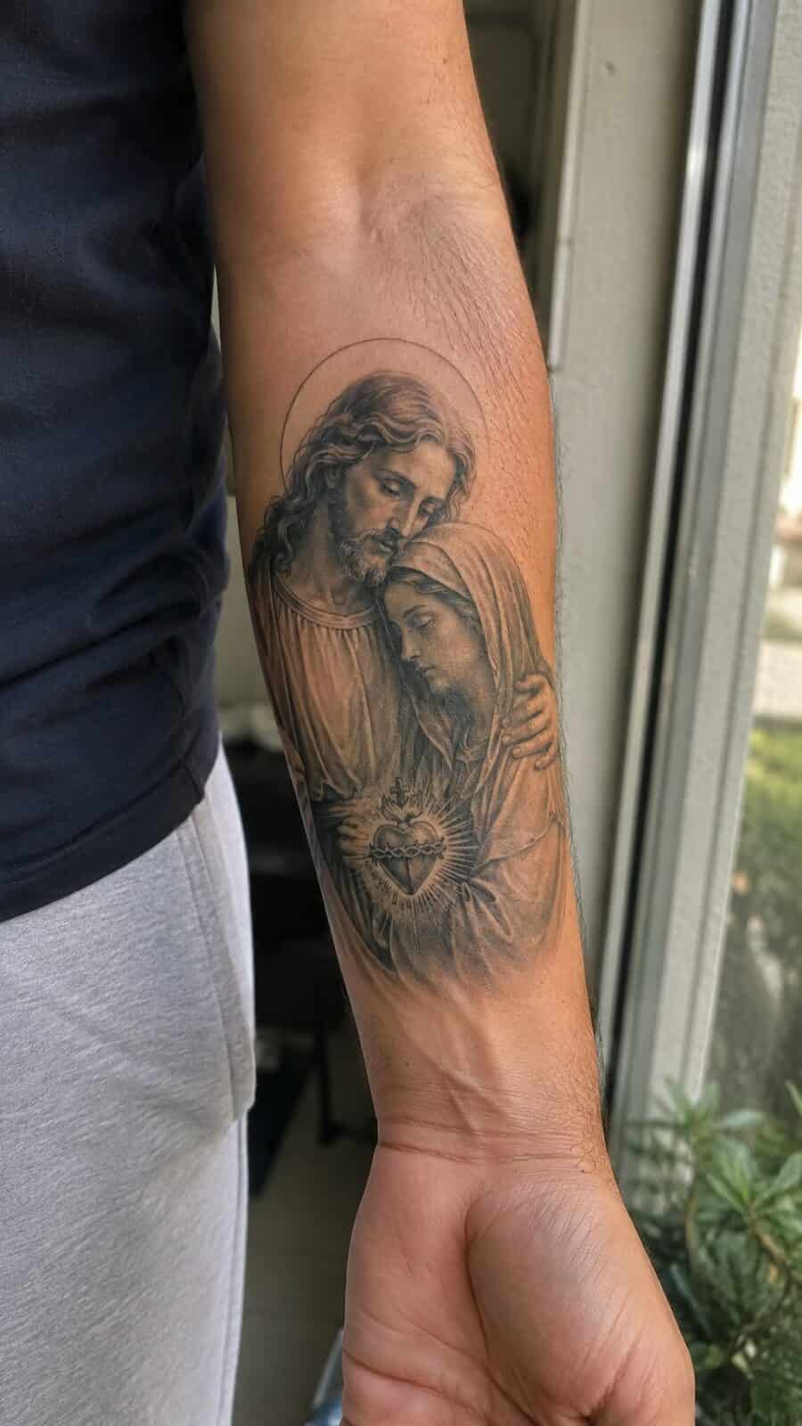 Exploring 18 Profound Jesus Tattoo Ideas for the Modern Man 30 Healed jesus and mary tattoo on a adult man's inner forearm, photographed in a natural gentle side angle that clearly shows how the — study 2