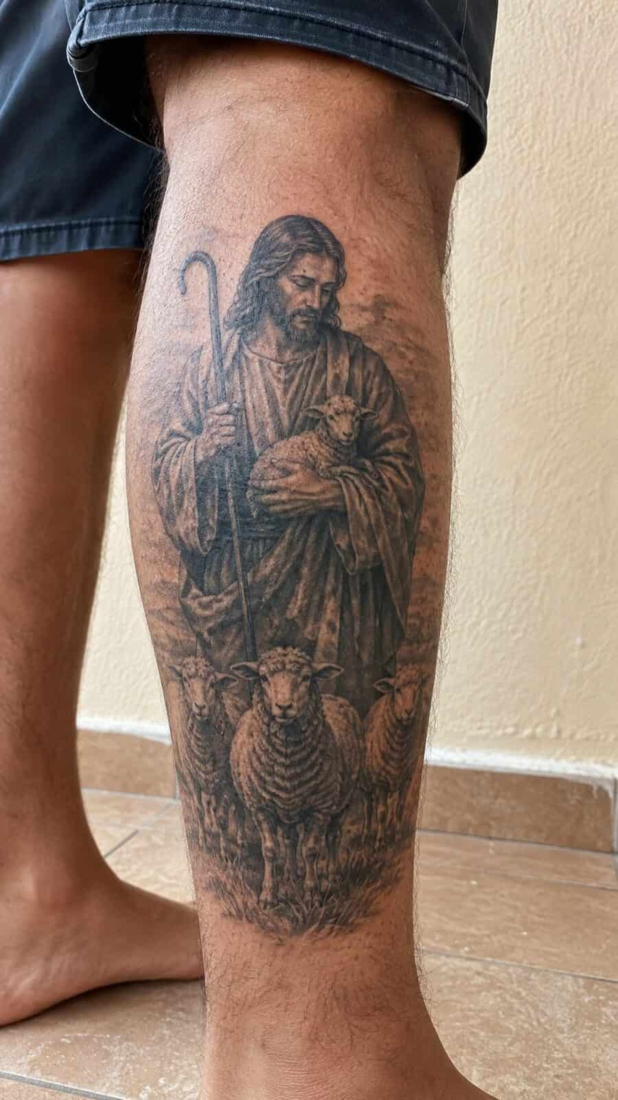 Exploring 18 Profound Jesus Tattoo Ideas for the Modern Man 31 Healed jesus as the good shepherd tattoo on a adult man's outer calf, photographed in a natural straight-on close view, a touch — study 1