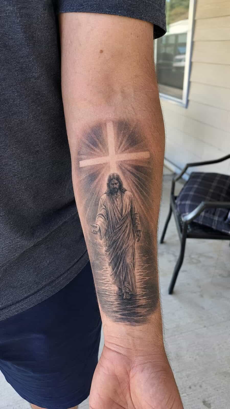 Exploring 18 Profound Jesus Tattoo Ideas for the Modern Man 35 Healed jesus with the cross of light tattoo on a adult man's inner forearm, photographed in a natural straight-on close view, a touch — study 1