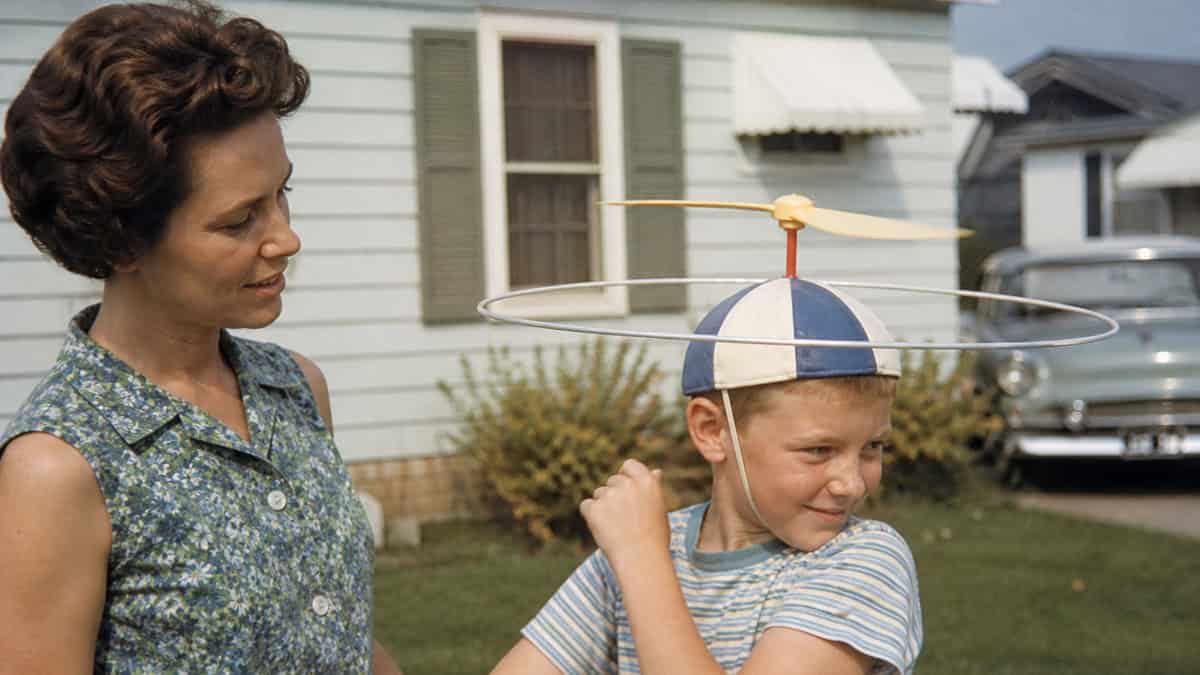 15 TV Commercials from Our Childhood That Would Be Banned Today 11 Child trying a head-worn spinning exercise toy outdoors in the 1960s