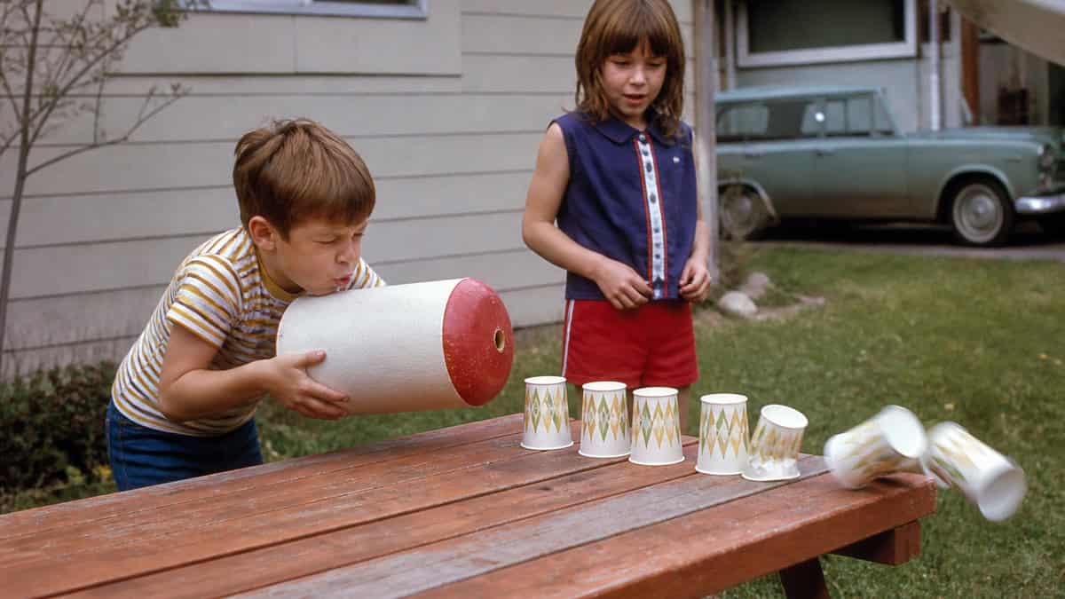 15 TV Commercials from Our Childhood That Would Be Banned Today 14 Child knocking over paper cups with an air-puff toy in the late 1960s