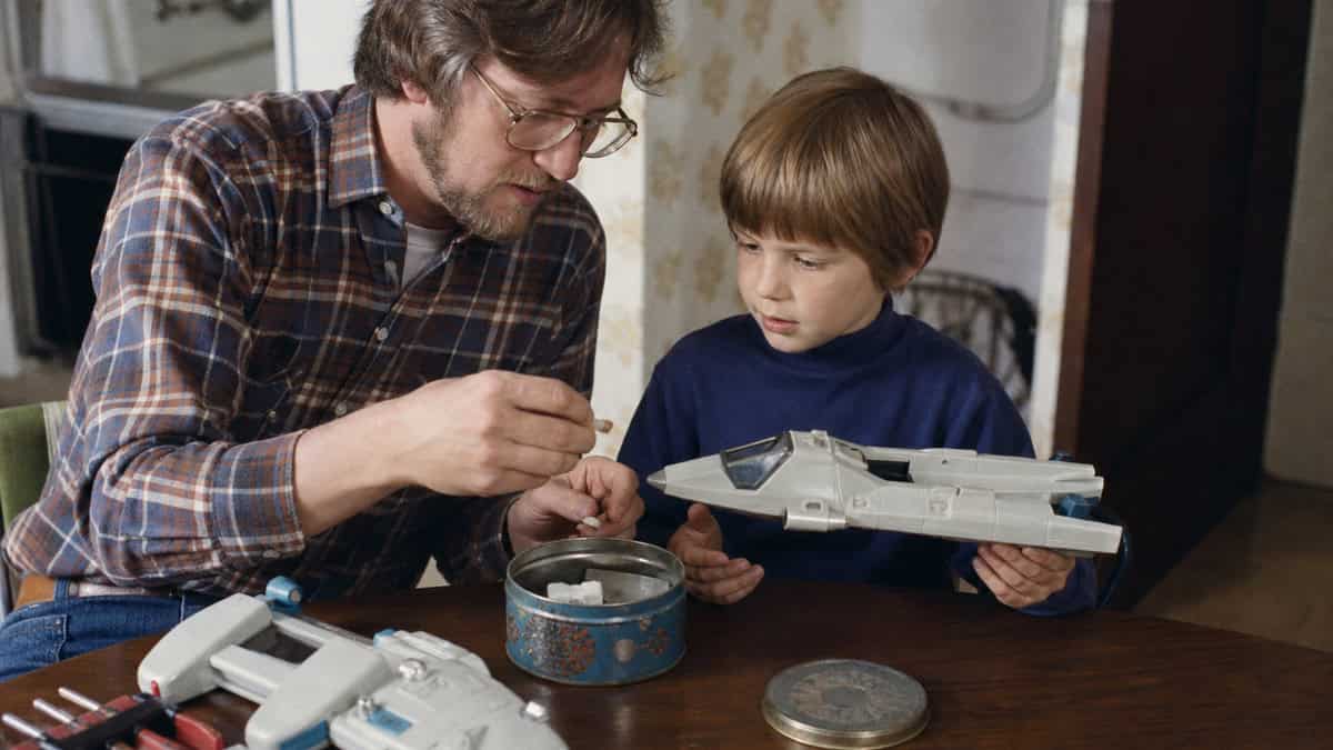 15 TV Commercials from Our Childhood That Would Be Banned Today 15 Parent securing a small loose part from a 1970s toy spacecraft