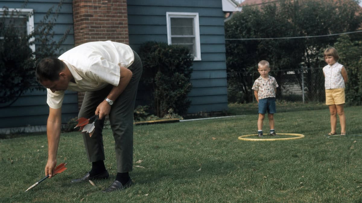 15 TV Commercials from Our Childhood That Would Be Banned Today 6 Parent putting away metal lawn darts in a late-1960s backyard