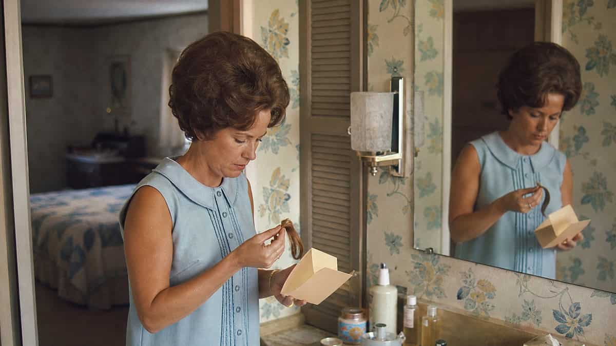 15 TV Commercials from Our Childhood That Would Be Banned Today 7 Woman considering home hair color at a 1960s vanity