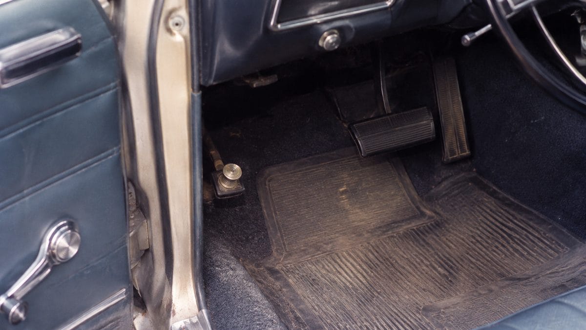 13 Classic Car Features That Confuse Today's Kids 2 Authentic classic car floorboard with high beam switch on far left