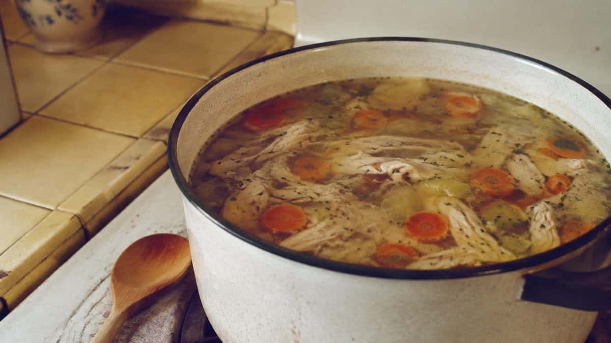 Home Remedies Every '60s Mom Swore By 9 Chicken soup simmering on a stove