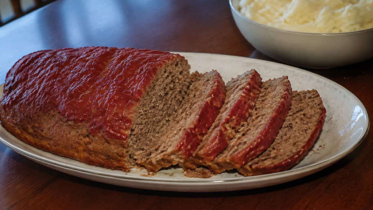 12 Comfort Foods That Taste Better Made the Old-Fashioned Way 9 Sliced meatloaf on a serving platter