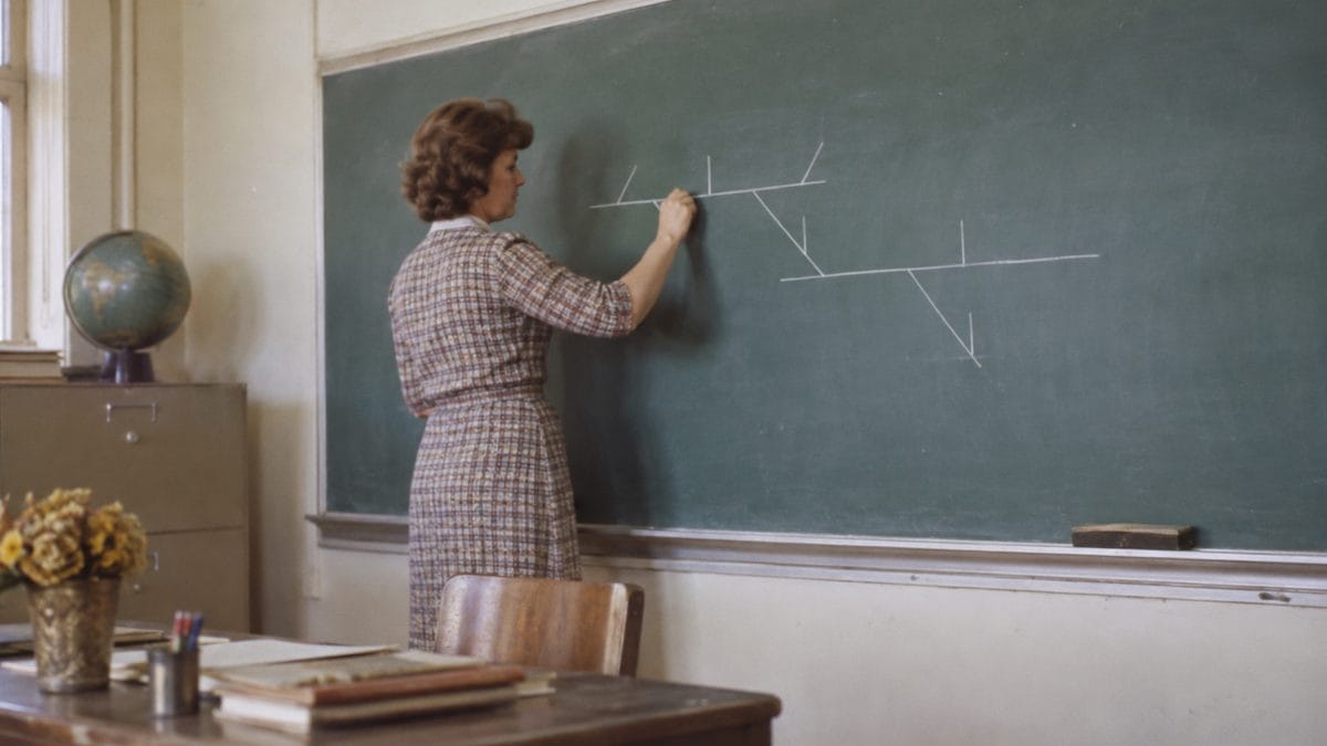 14 Things Teachers Swore We'd Need That We Haven't Used Since 1975 3 Genuine vintage photo of a teacher writing a real sentence diagram on a chalkboard