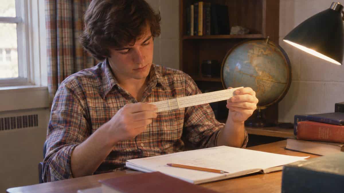 14 Things Teachers Swore We'd Need That We Haven't Used Since 1975 4 Student correctly holding and using a real slide rule