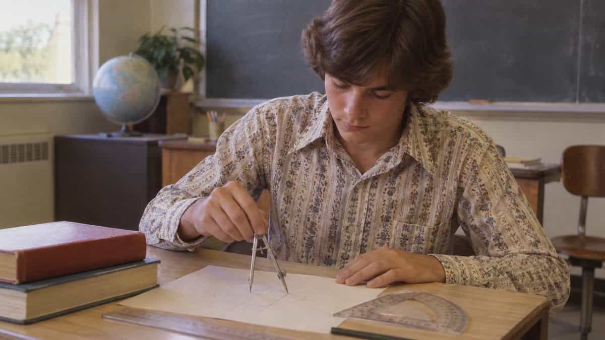 14 Things Teachers Swore We'd Need That We Haven't Used Since 1975 9 Student using a compass and protractor in a 1970s classroom