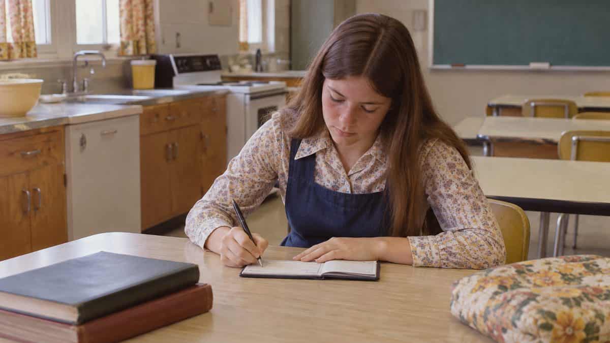 14 Things Teachers Swore We'd Need That We Haven't Used Since 1975 10 Student writing a check in a 1970s home economics class