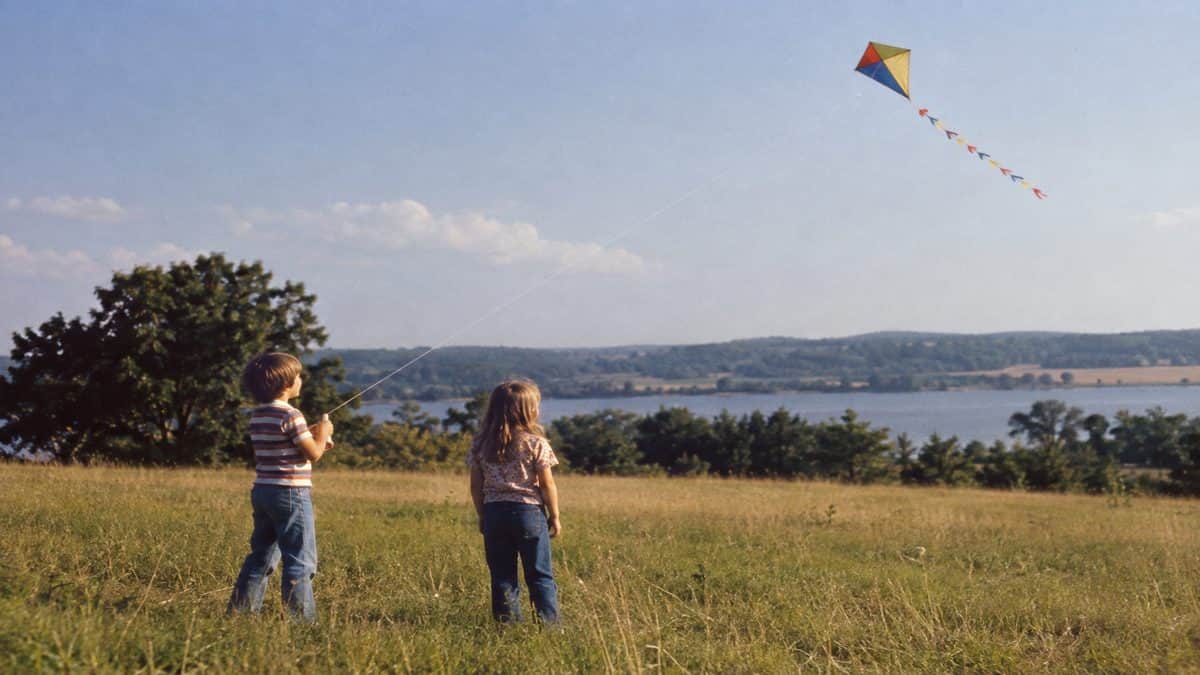 Before Screens: How We Entertained Ourselves 14 Kids flying a kite