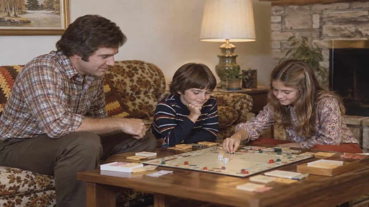Before Screens: How We Entertained Ourselves 10 Family playing a classic board game