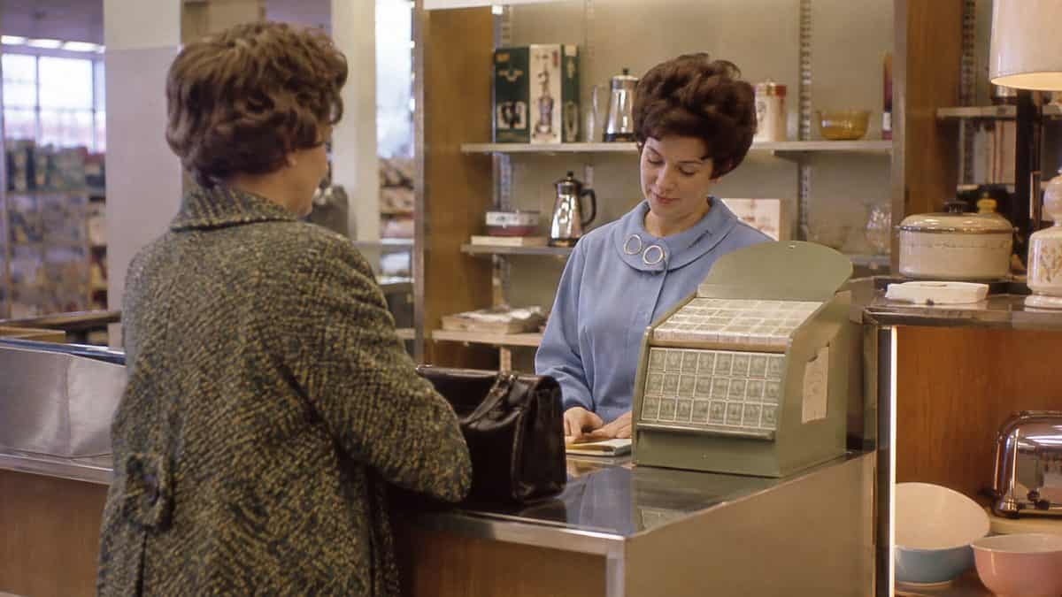 15 Grocery Store Features from the '60s That Have Vanished 3 Customer redeeming S&H Green Stamps