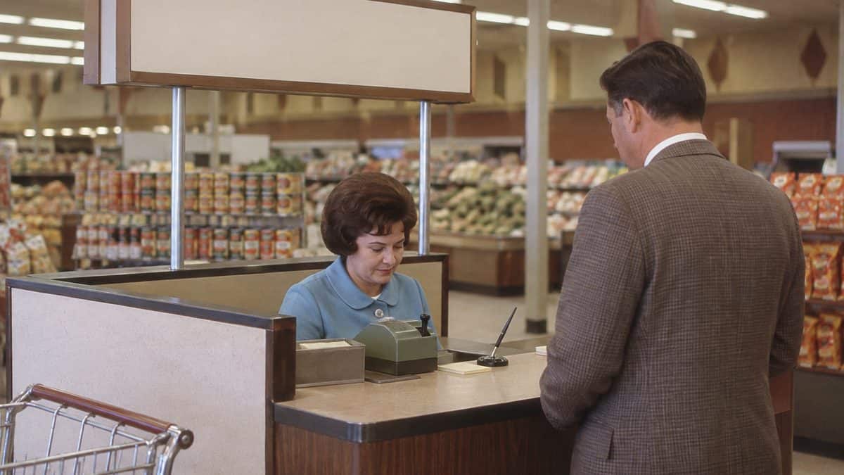 15 Grocery Store Features from the '60s That Have Vanished 10 1960s check approval desk.