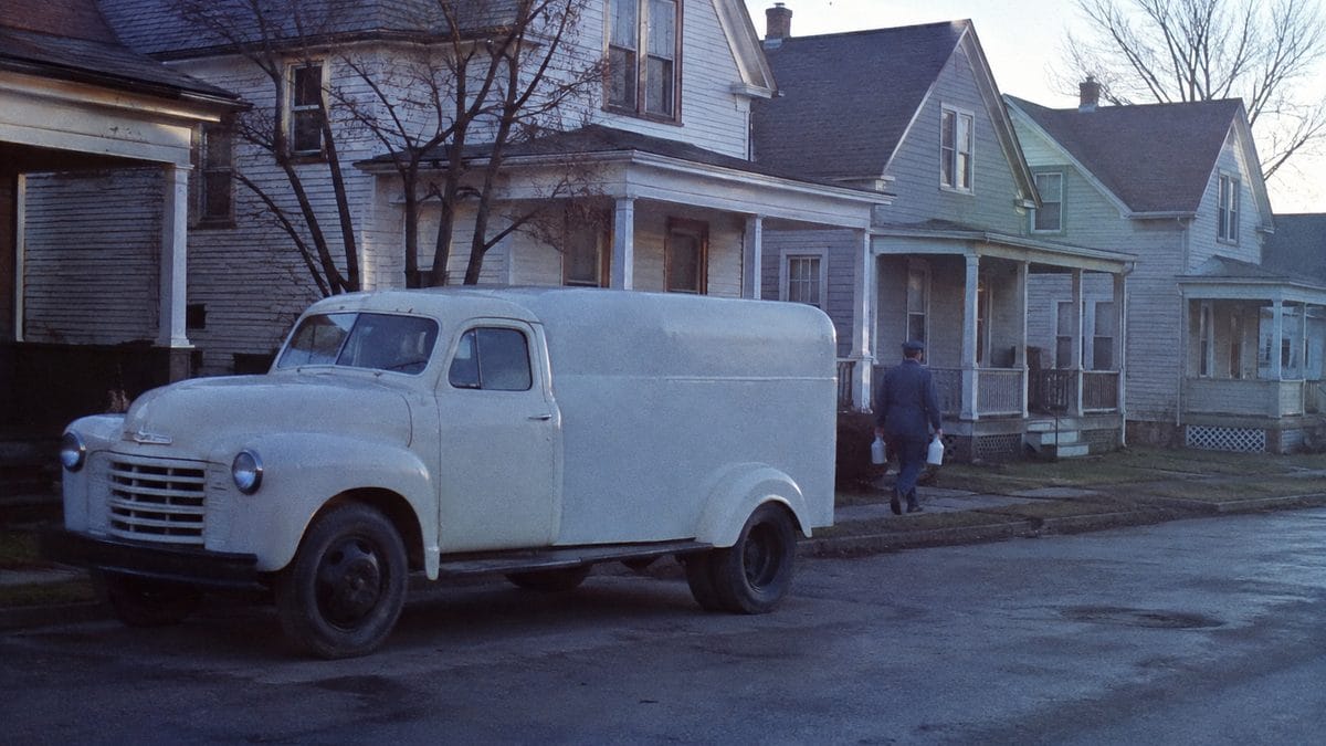 12 Things Every Kid Who Grew Up With a Milkman Remembers 11 Milk truck on a residential street