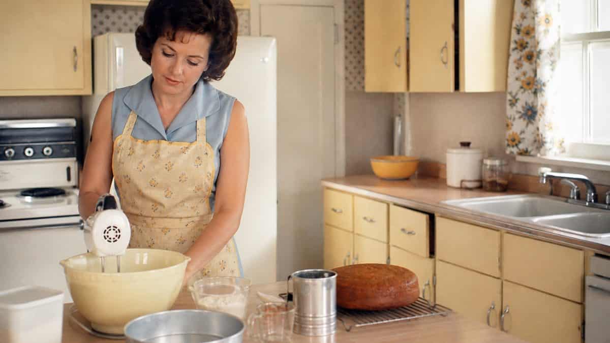 Life Skills Our Generation Mastered That Barely Exist Anymore 8 Woman baking in a 1960s kitchen