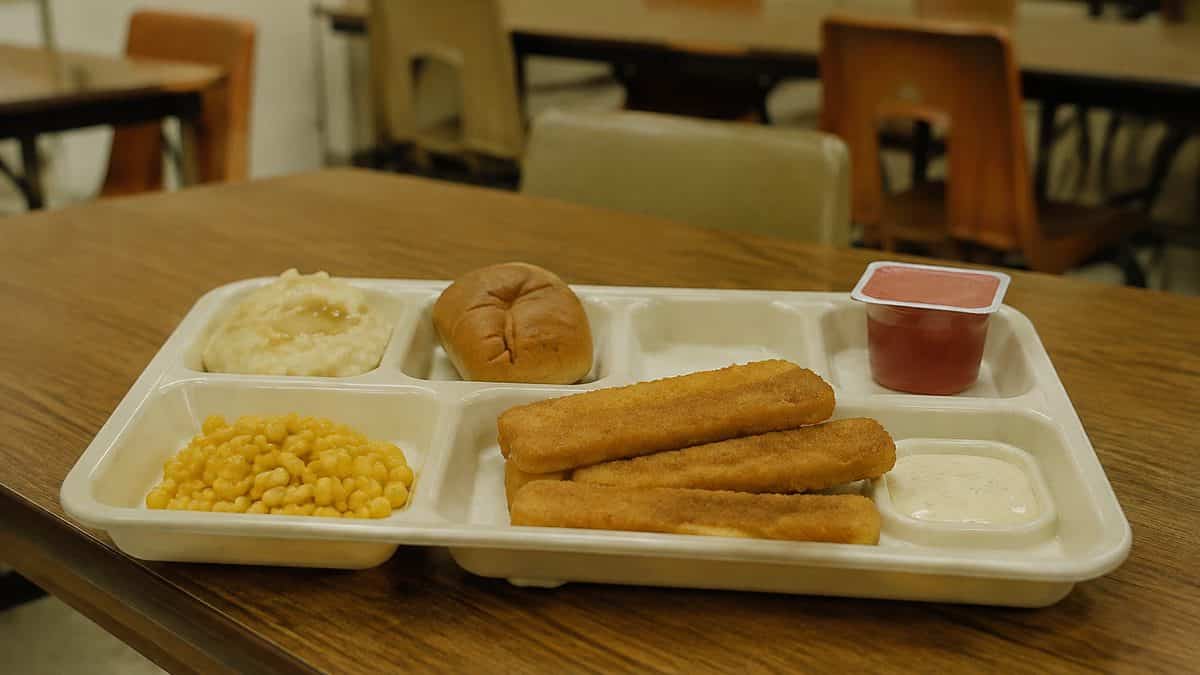 School Cafeteria Food from the '70s We Secretly Loved 9 Fish sticks on a classic compartmentalized school lunch tray