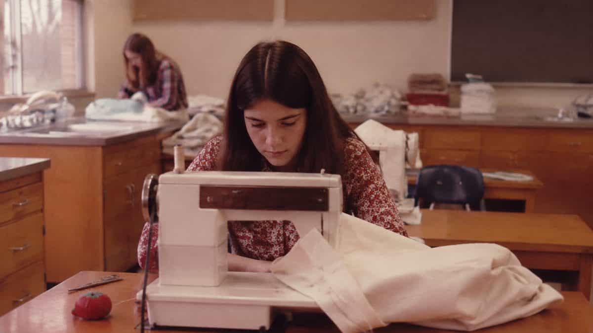 12 Basic Life Skills We Learned in Home Economics That Kids Don't Learn Today 2 Students in a 1970s home economics sewing class.