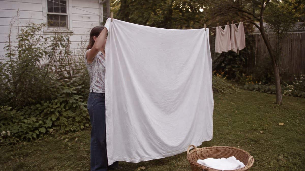 12 Basic Life Skills We Learned in Home Economics That Kids Don't Learn Today 7 Someone hanging laundry